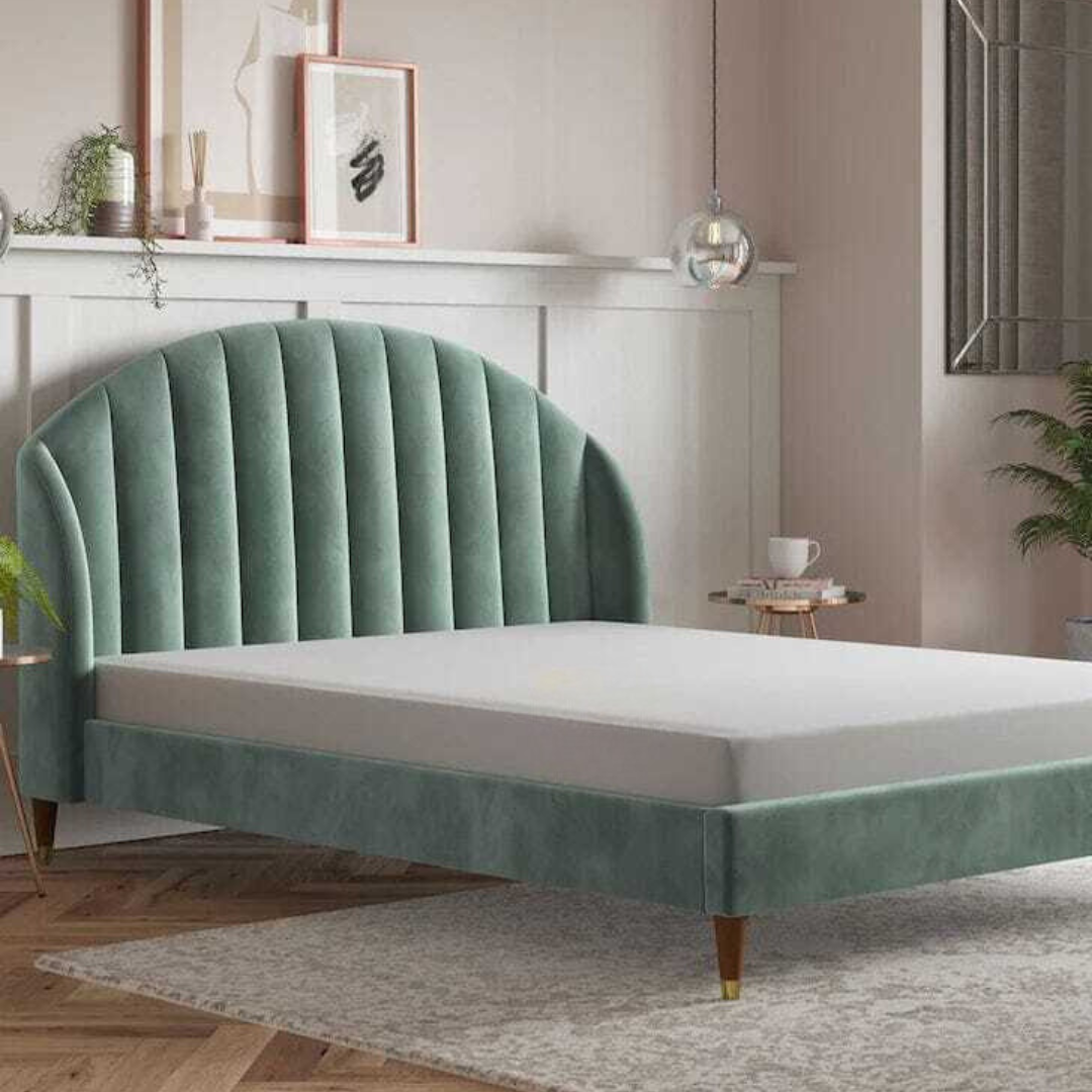 A bed with mattress green and white colour