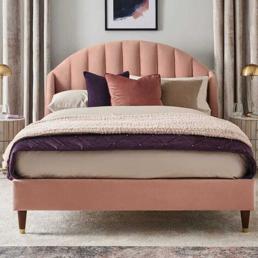 A bed with mattress pink colour