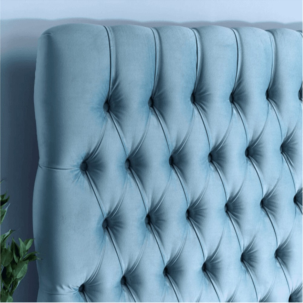 A bed with mattress sky blue