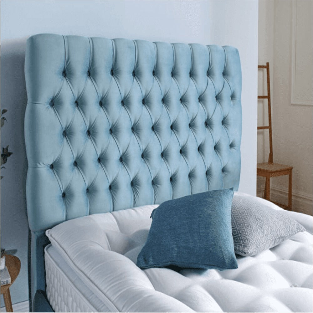A bed with mattress blue colour
