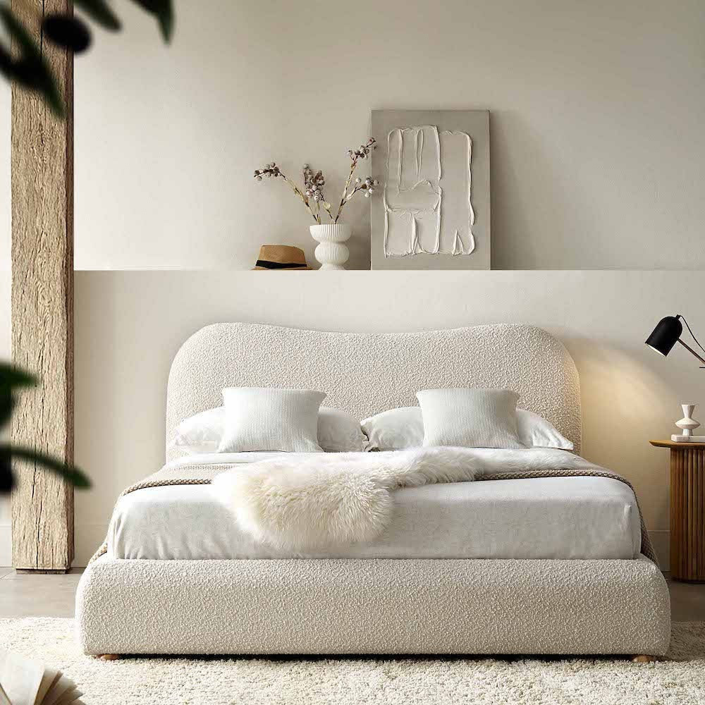 A bed with mattress white colour