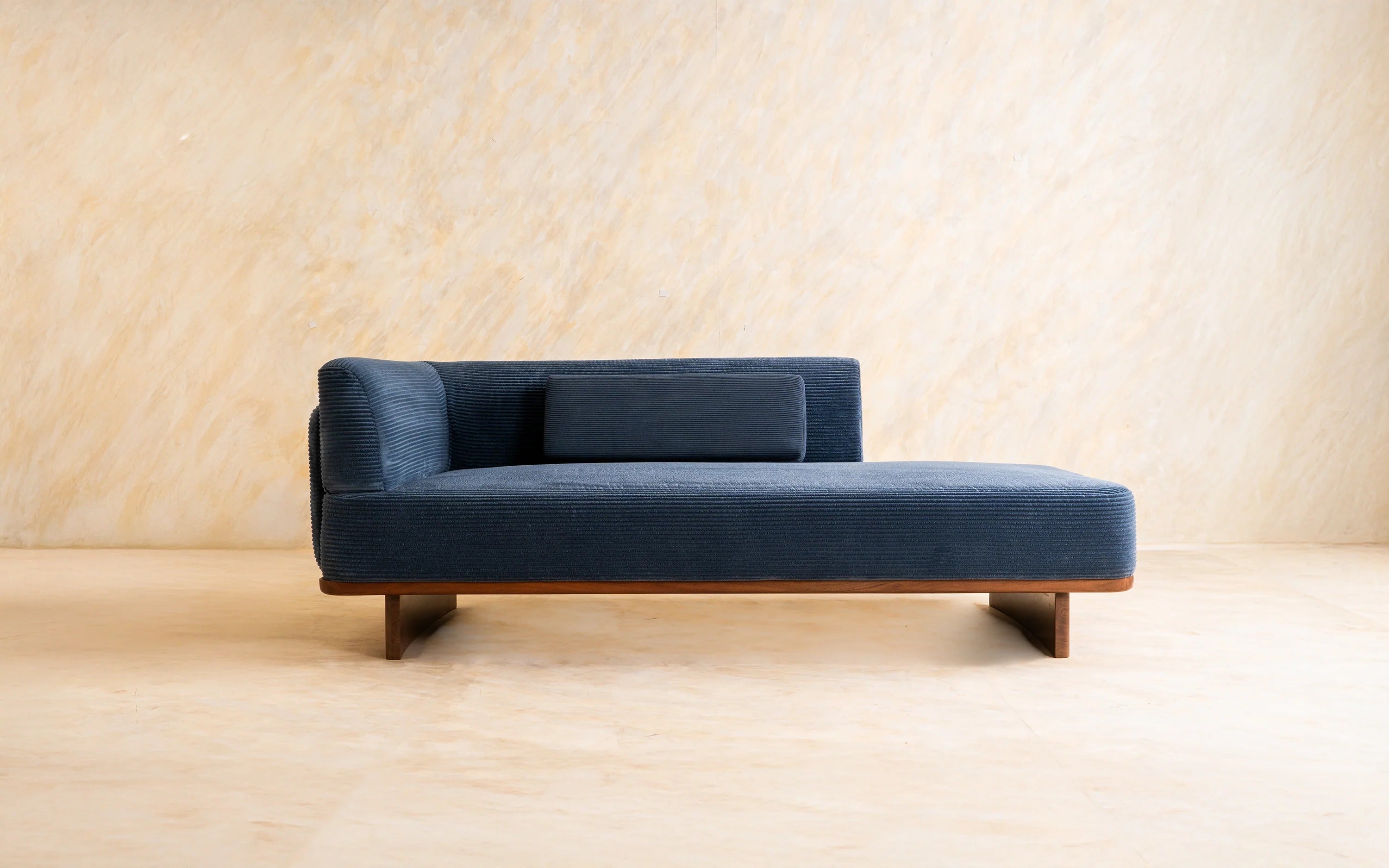 Blue corduroy upholstered daybed.