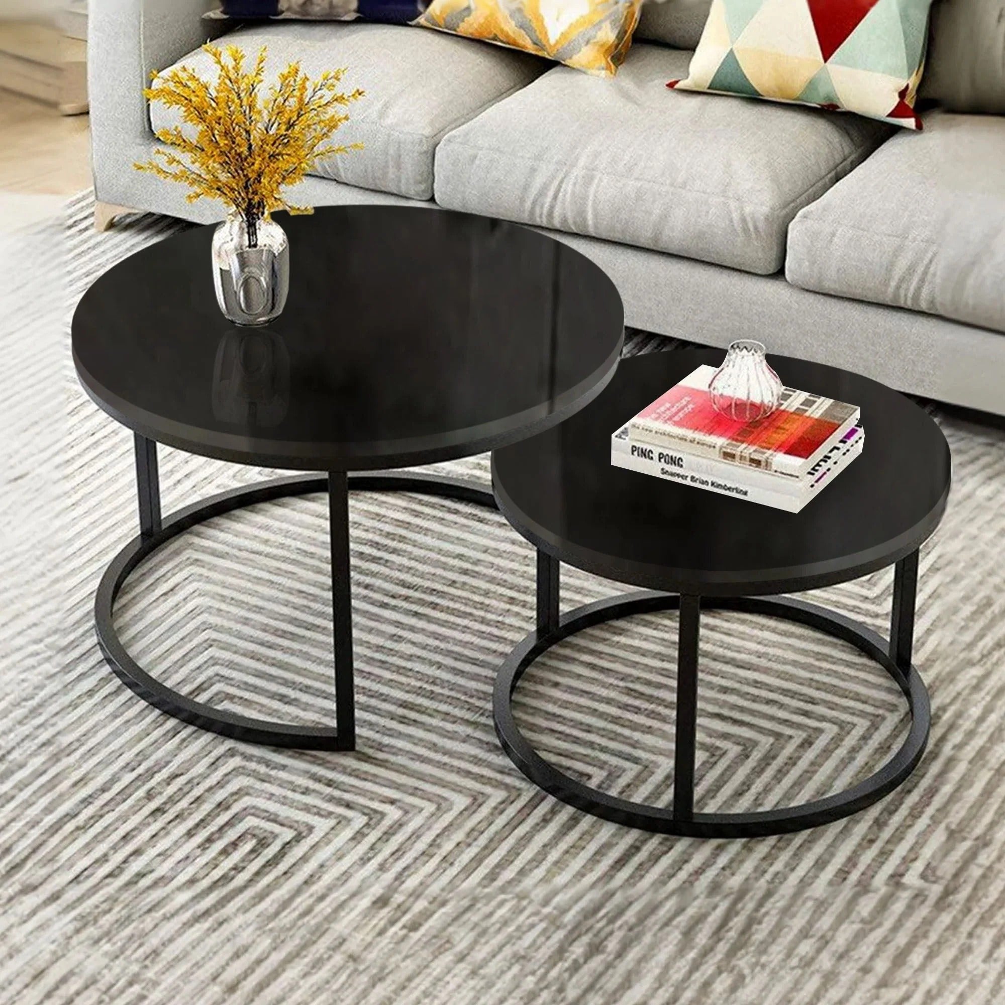 Sleek black round nesting coffee table