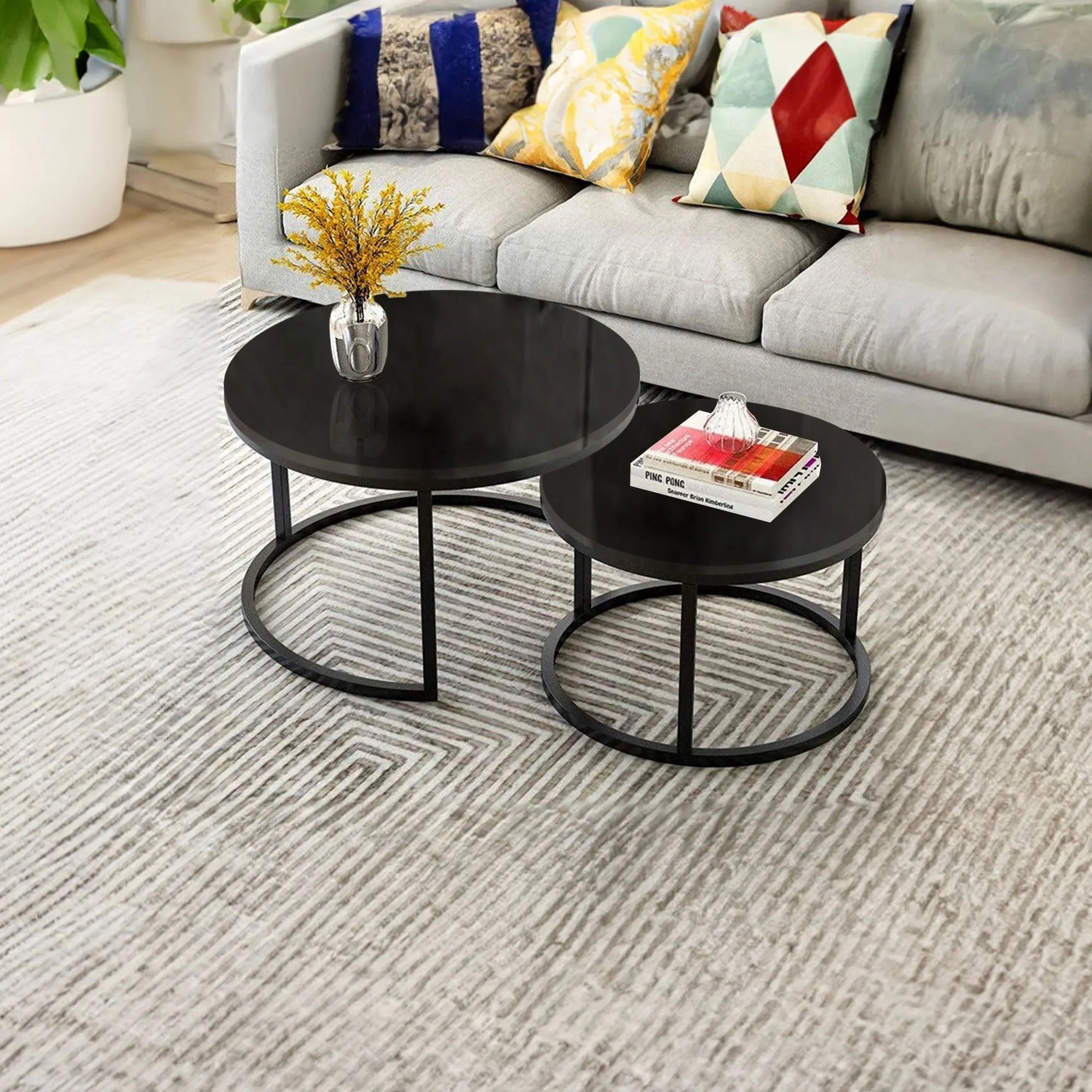 Sleek black round nesting coffee table