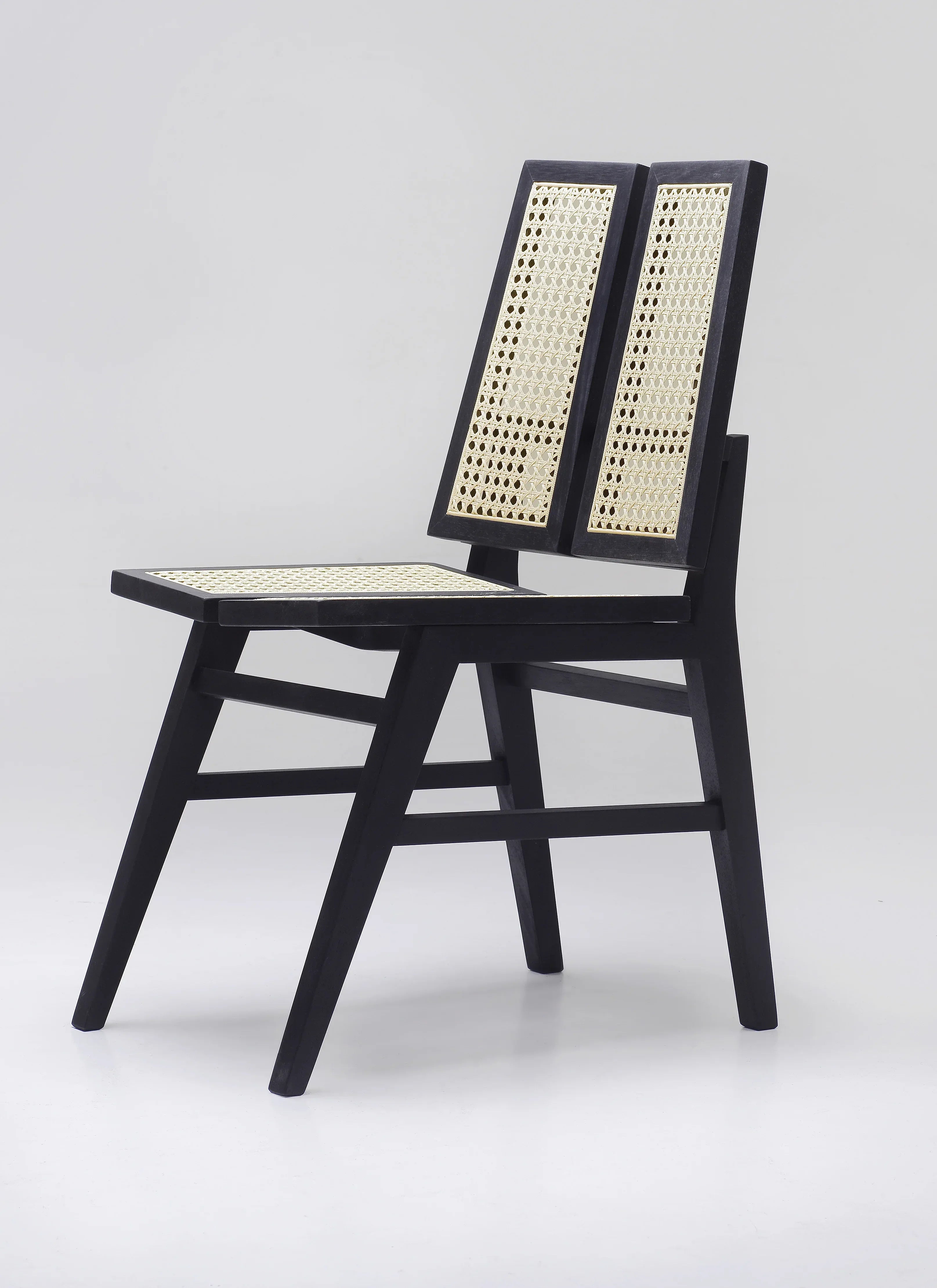 Split-back black cane Dining chair.
