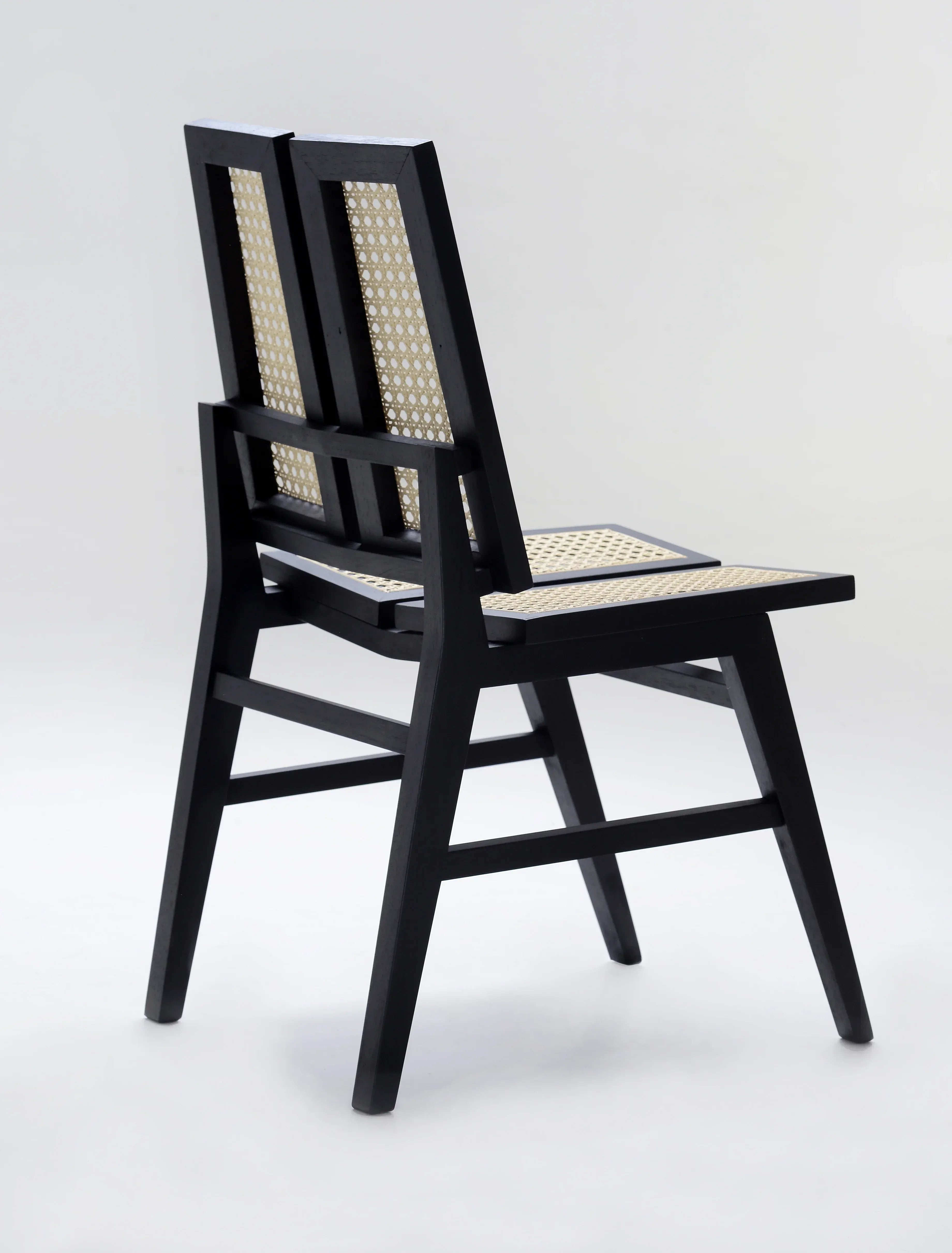 Split-back black cane Dining chair.