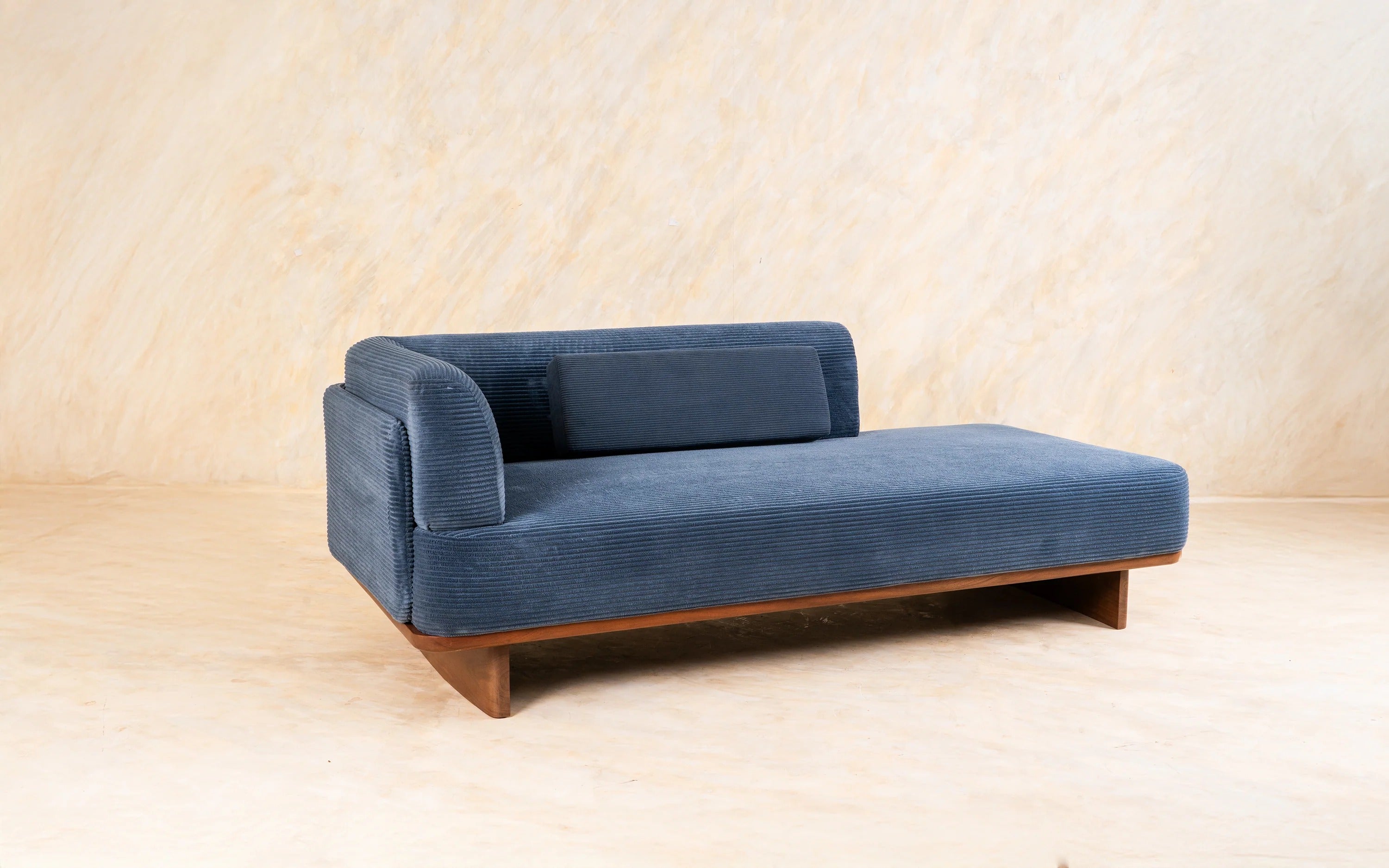 Blue corduroy upholstered daybed.